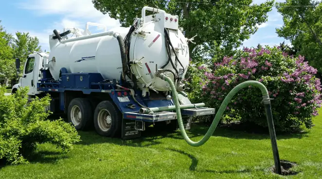 Professional vacuum truck performing residential drainage and septic maintenance in Memphis, TN